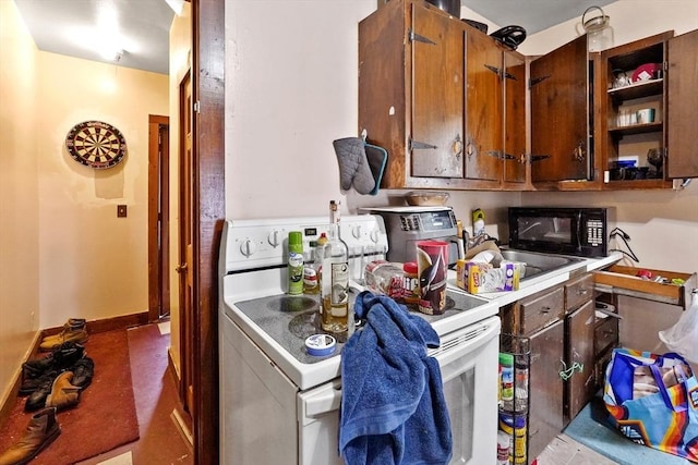 32 Worcester Rd, Charlton, MA 01507 - kitchen featuring electric range, black microwave, and light countertops