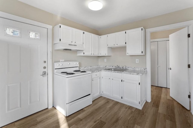32 Worcester Rd, Charlton, MA 01507 - kitchen with white range with electric stovetop, under cabinet range hood, and wood finished floors
