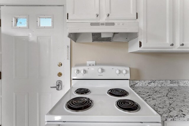 32 Worcester Rd, Charlton, MA 01507 - kitchen featuring electric stove, under cabinet range hood, light countertops, and white cabinets