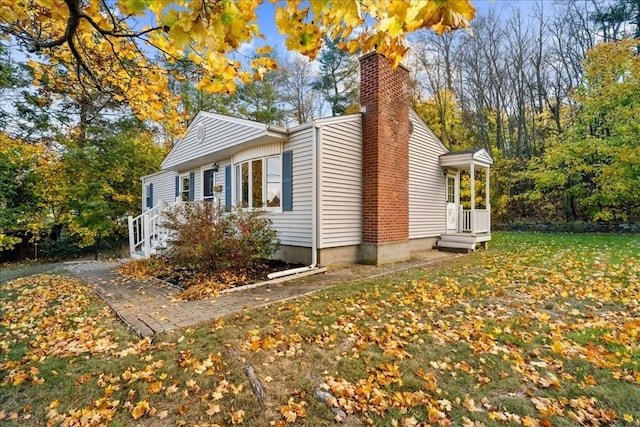 view of property exterior with a yard