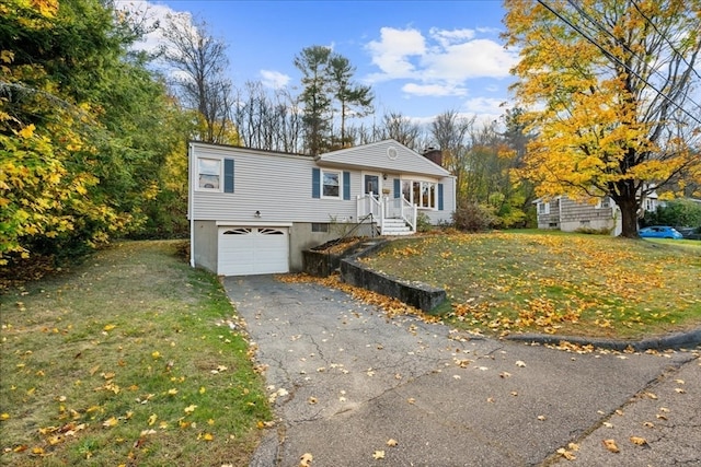 view of front facade with a front lawn and a garage