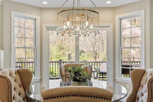 dining area featuring recessed lighting, a chandelier, and a wealth of natural light