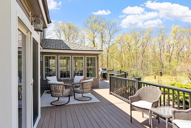 wooden deck with grilling area