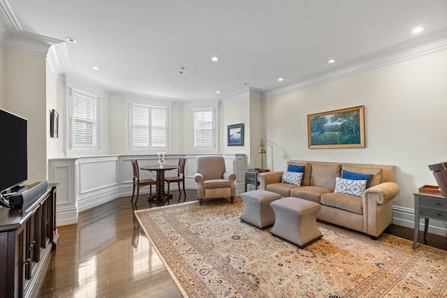 living room featuring light wood-type flooring and ornamental molding