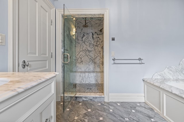 bathroom with tile patterned floors, vanity, and a shower with door