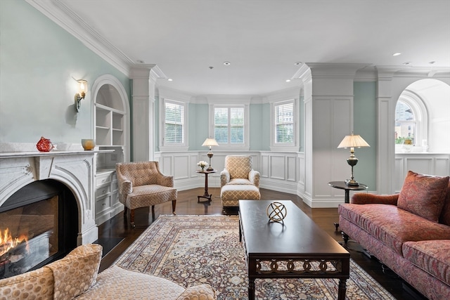 living room featuring ornamental molding and dark hardwood / wood-style floors