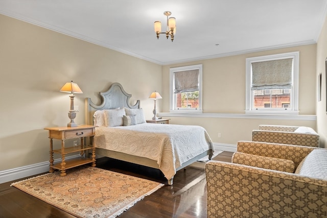 bedroom with dark wood-type flooring, a chandelier, and crown molding