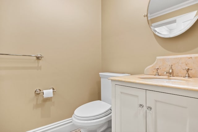 bathroom with toilet and vanity