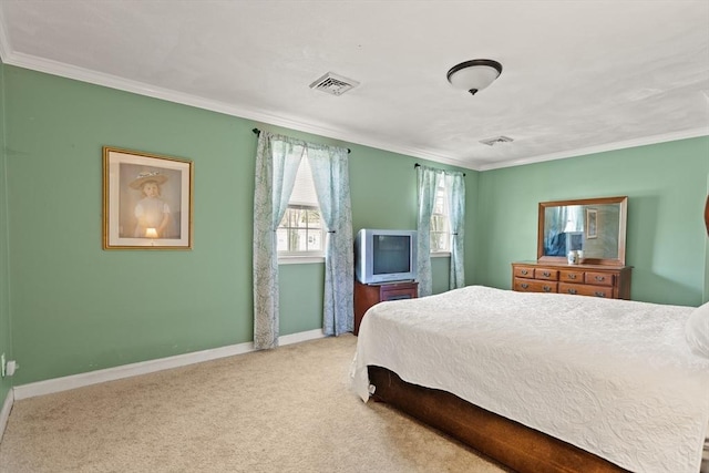carpeted bedroom with baseboards, ornamental molding, and visible vents
