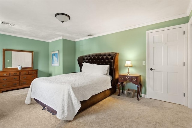 carpeted bedroom with visible vents and ornamental molding