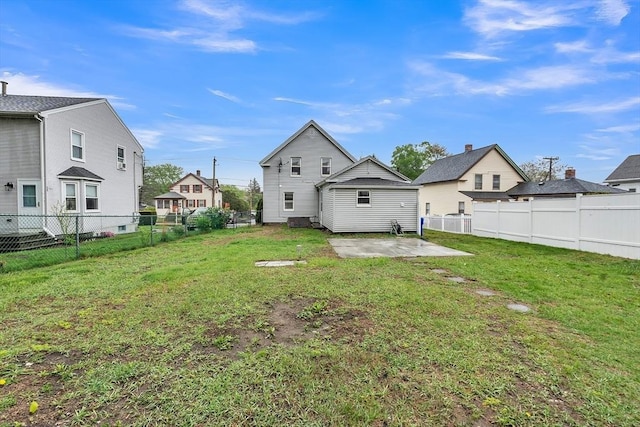 rear view of house featuring a patio and a residential view