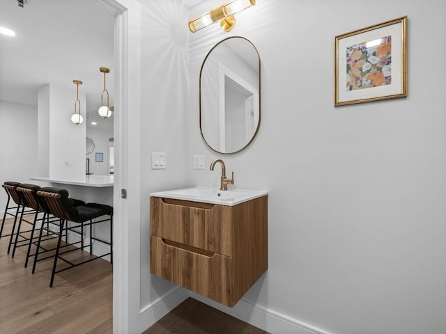 bathroom featuring vanity and hardwood / wood-style flooring