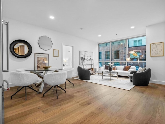 dining space with light hardwood / wood-style flooring