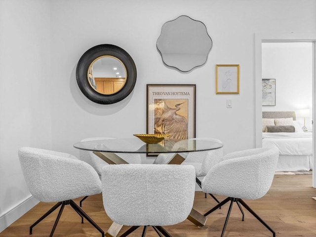 dining space featuring light wood-type flooring