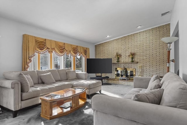 living room featuring brick wall, carpet, and a fireplace