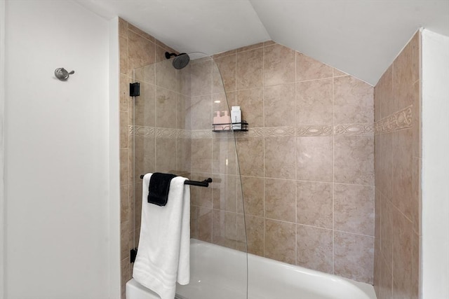 bathroom featuring vaulted ceiling and combined bath / shower with glass door