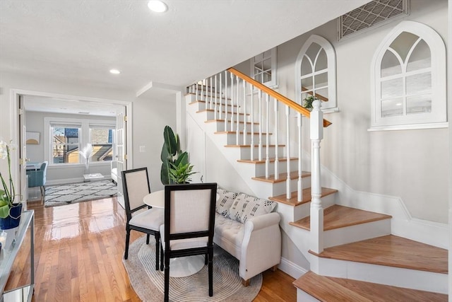 stairway with hardwood / wood-style flooring