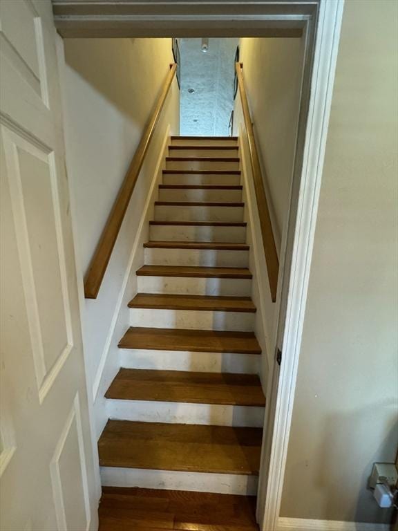 staircase featuring wood finished floors