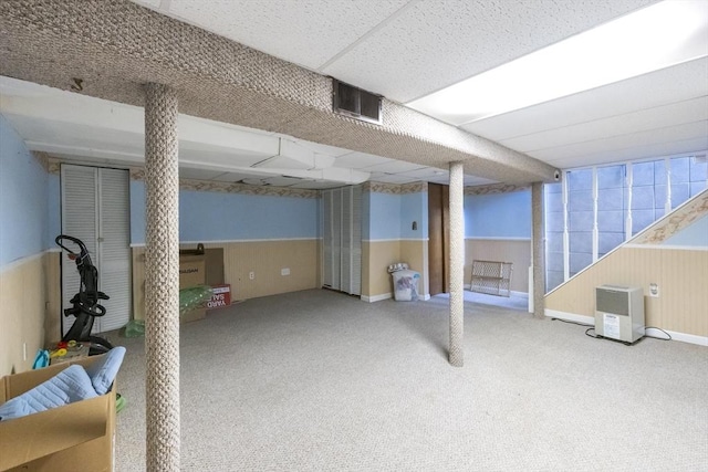 16 Kaveney St, Chicopee, MA 01020 - finished basement with carpet flooring, a wainscoted wall, and wooden walls
