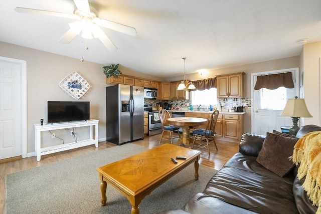 16 Kaveney St, Chicopee, MA 01020 - living area with light wood finished floors and a ceiling fan