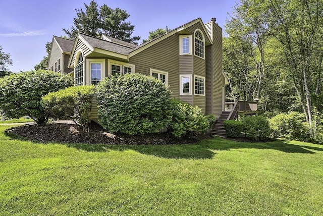 8 Birchwood Ln Unit 8, Hopkinton, MA 01748 - view of property exterior with a chimney, stairs, a yard, and a wooden deck