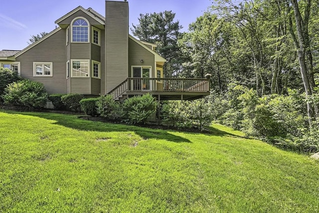 8 Birchwood Ln Unit 8, Hopkinton, MA 01748 - rear view of house with a wooden deck, a chimney, and a lawn
