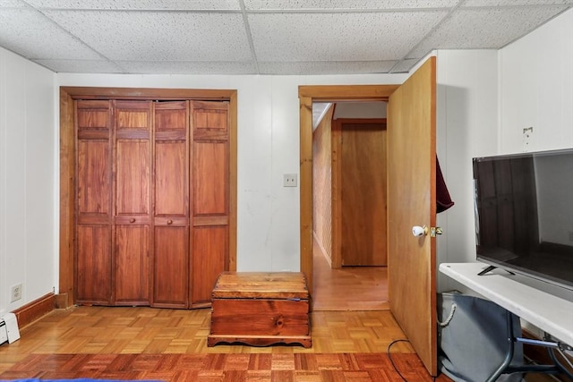 laundry area with light parquet floors