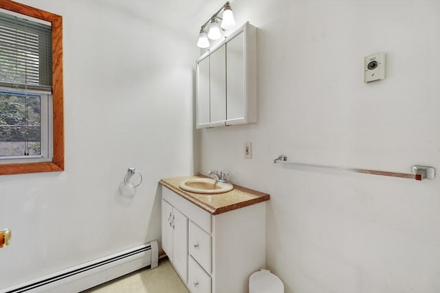 bathroom with a baseboard heating unit and vanity