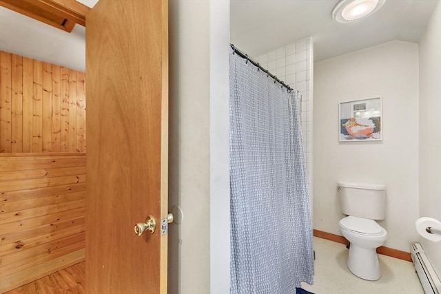 bathroom featuring baseboard heating, toilet, and a shower with shower curtain