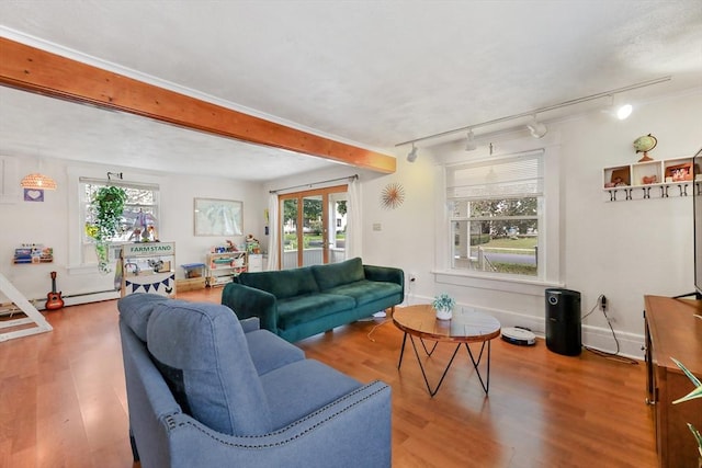 living room with track lighting, french doors, and hardwood / wood-style floors