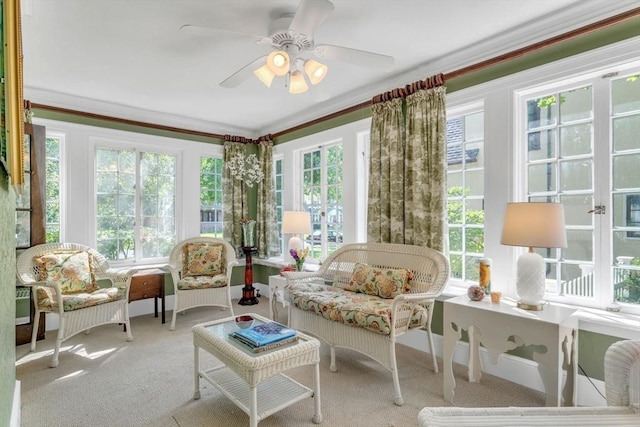 sunroom / solarium with a ceiling fan