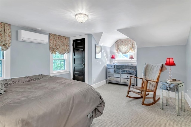 carpeted bedroom with a closet, a wall mounted AC, baseboards, and vaulted ceiling