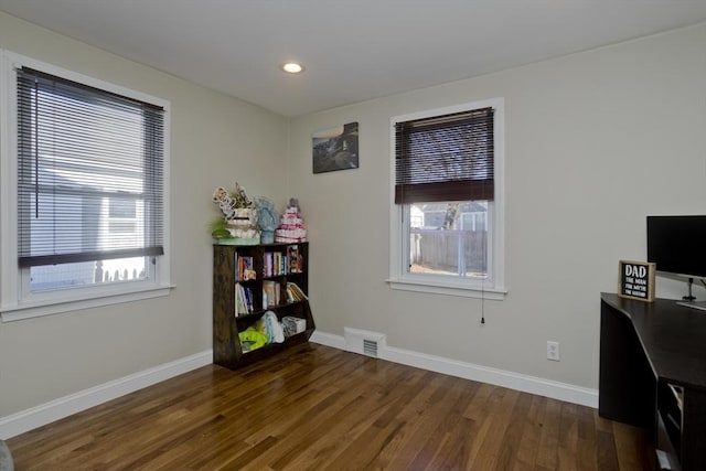 miscellaneous room featuring dark hardwood / wood-style flooring