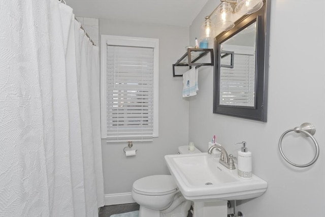 bathroom featuring sink and toilet