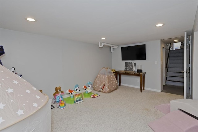 game room with light colored carpet