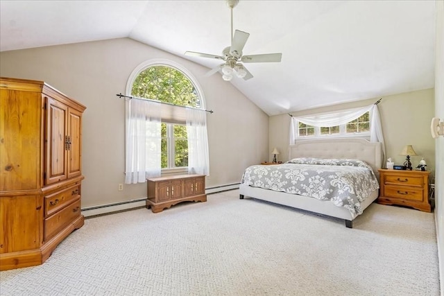 bedroom featuring baseboard heating, lofted ceiling, light carpet, a baseboard radiator, and a ceiling fan