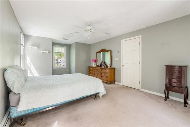 bedroom featuring baseboards, light carpet, a ceiling fan, and baseboard heating