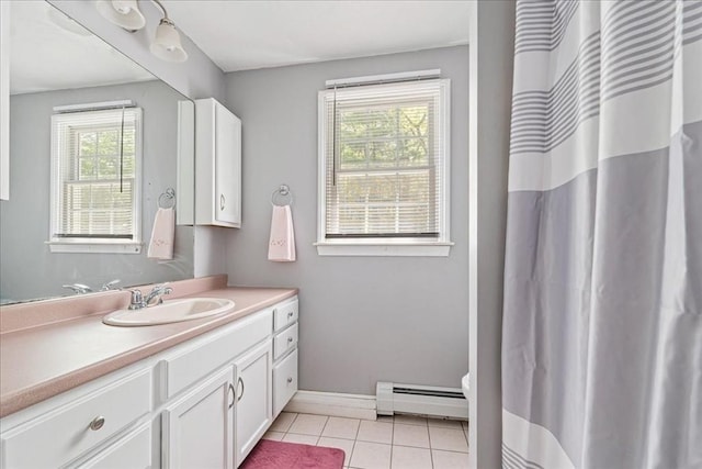 full bath with baseboard heating, tile patterned flooring, vanity, baseboards, and a shower with shower curtain