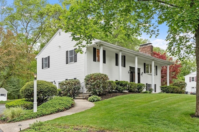 46 Salem St, Methuen, MA 01844 - bi-level home with a front yard and a chimney