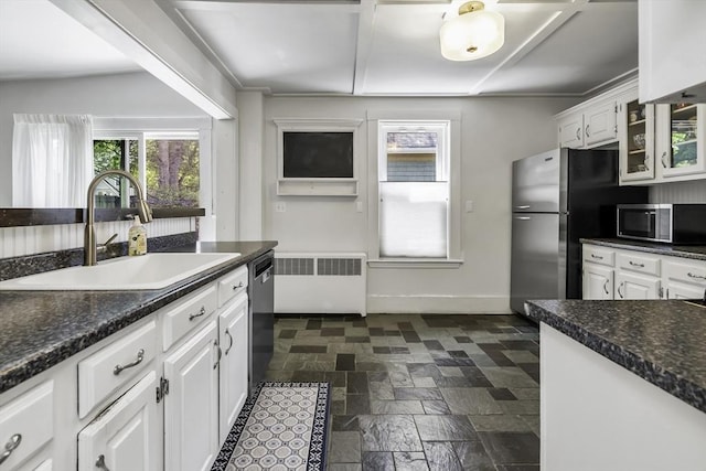 453 Washington St, Gloucester, MA 01930 - kitchen featuring a sink, appliances with stainless steel finishes, radiator, white cabinets, and baseboards
