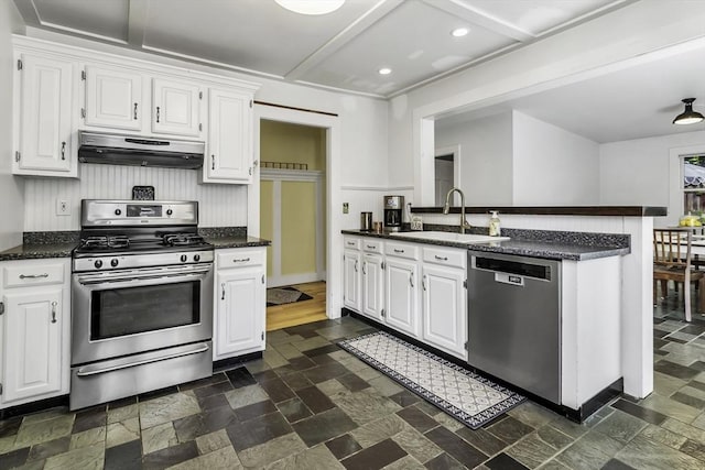 453 Washington St, Gloucester, MA 01930 - kitchen featuring stainless steel appliances, under cabinet range hood, a sink, white cabinets, and recessed lighting