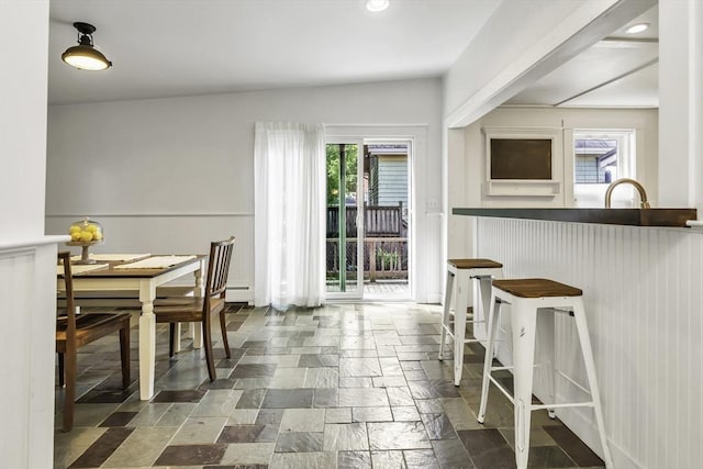 453 Washington St, Gloucester, MA 01930 - dining space with stone tile floors, healthy amount of natural light, wainscoting, a baseboard heating unit, and recessed lighting