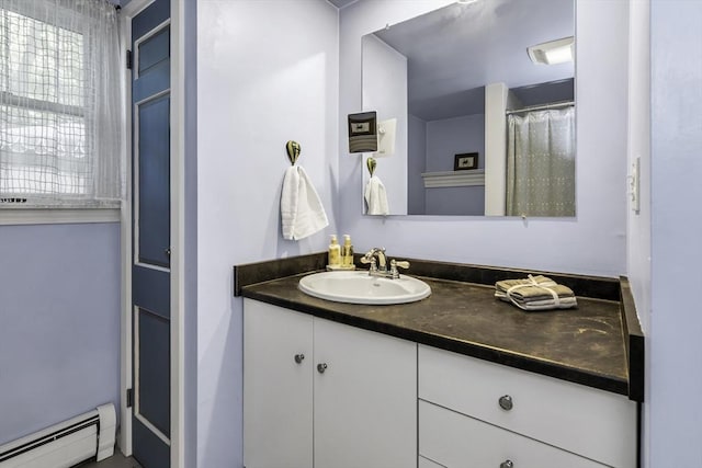 453 Washington St, Gloucester, MA 01930 - bathroom featuring a baseboard radiator and vanity