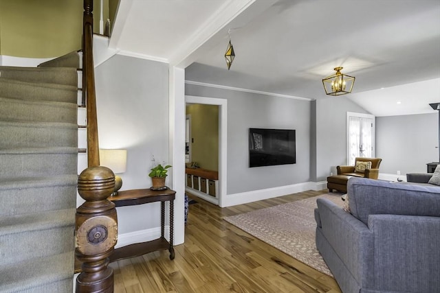 453 Washington St, Gloucester, MA 01930 - living room with wood finished floors, baseboards, stairway, a chandelier, and vaulted ceiling