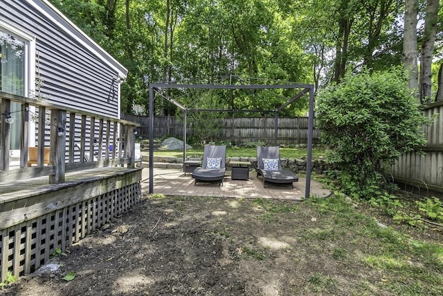 453 Washington St, Gloucester, MA 01930 - fenced backyard featuring a patio area and view of wooded area