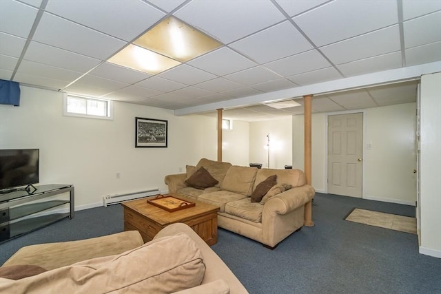 carpeted living area featuring baseboards, a baseboard heating unit, and a drop ceiling