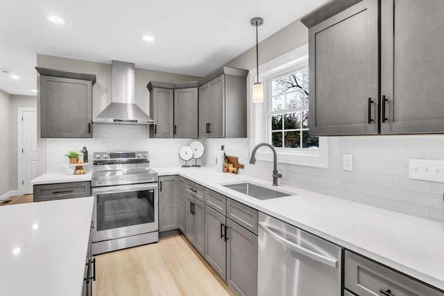 LOT3 Montgomery Rd, Westfield, MA 01085 - kitchen with appliances with stainless steel finishes, wall chimney exhaust hood, a sink, light wood-style floors, and light countertops