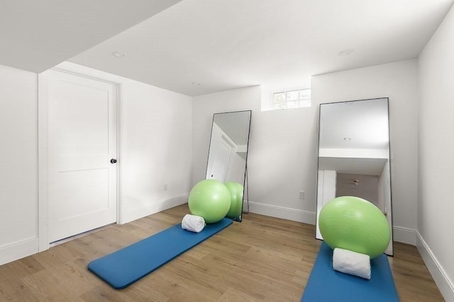 workout area featuring light hardwood / wood-style floors