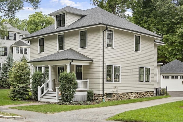 view of front facade featuring covered porch and a garage