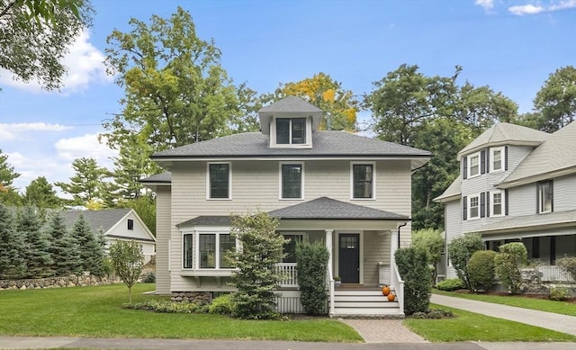 view of front of house with a front lawn and a porch